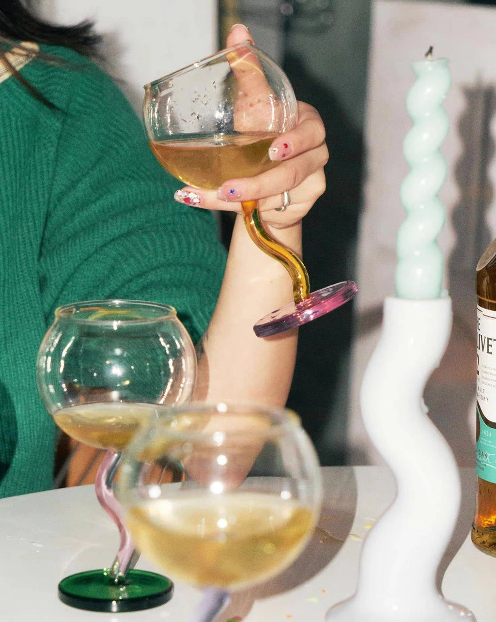 Handcrafted Bubble Wine Glass featuring a Curved Wavy Stem