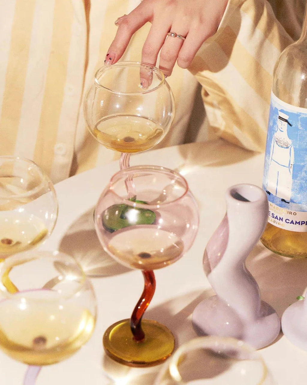 Handcrafted Bubble Wine Glass featuring a Curved Wavy Stem