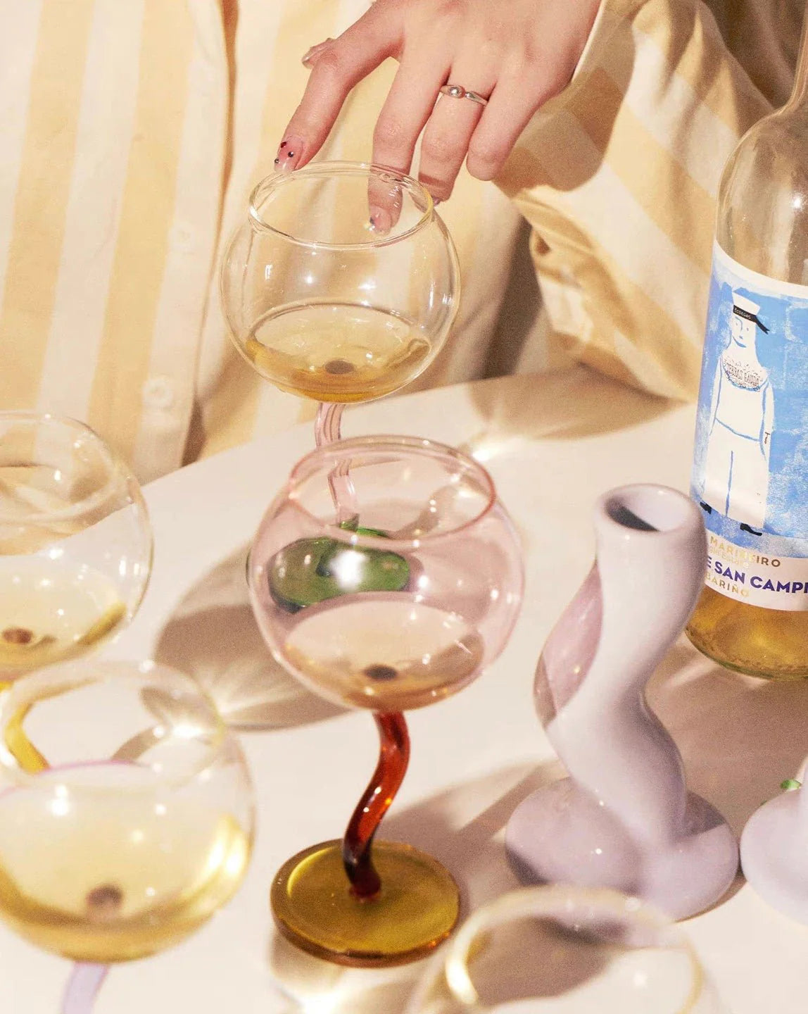 Handcrafted Bubble Wine Glass featuring a Curved Wavy Stem